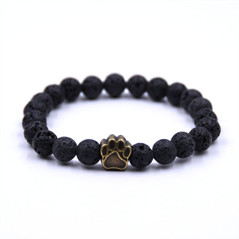 Midnight Paw Bracelet — lava stone, gold paw charm
